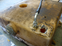 Damaged plastic fuel tank